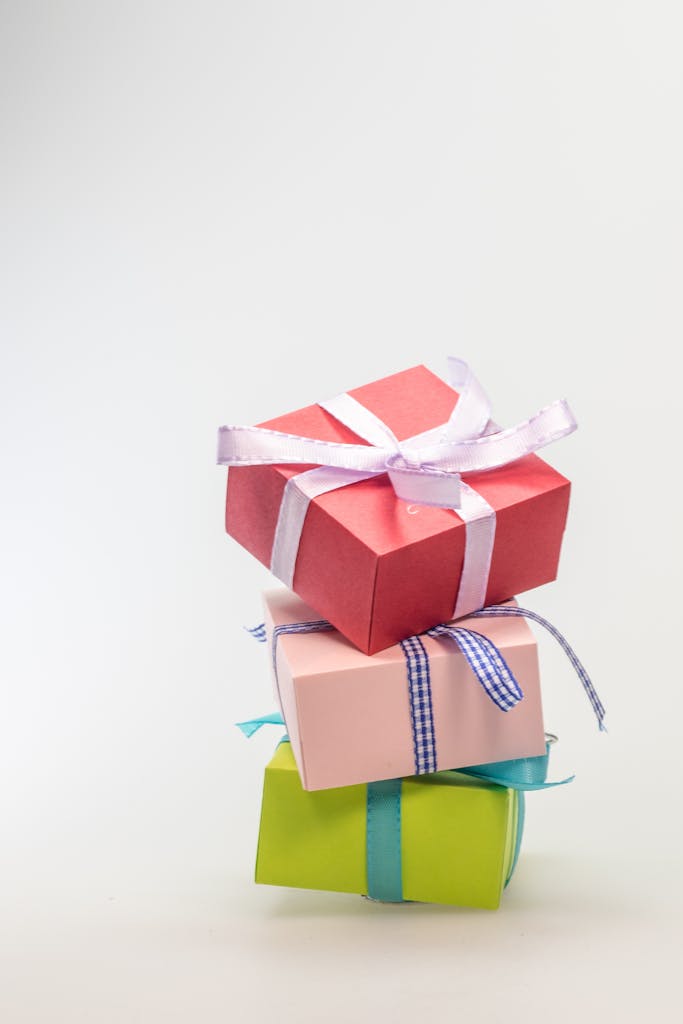 A stack of colorful gift boxes tied with ribbons, perfect for celebrations and festive occasions.